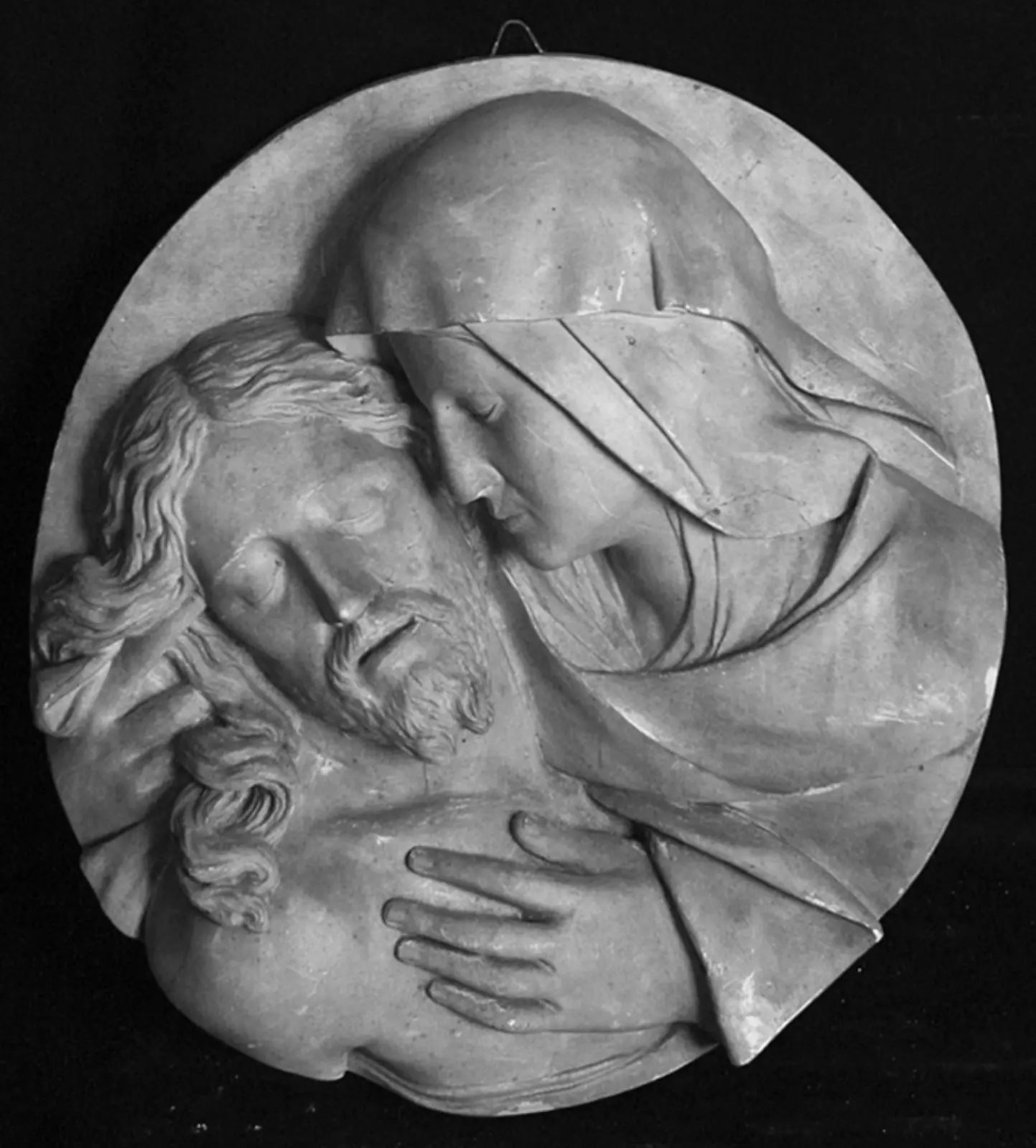 Tondo. Pietà. Maria og Kristi hoveder