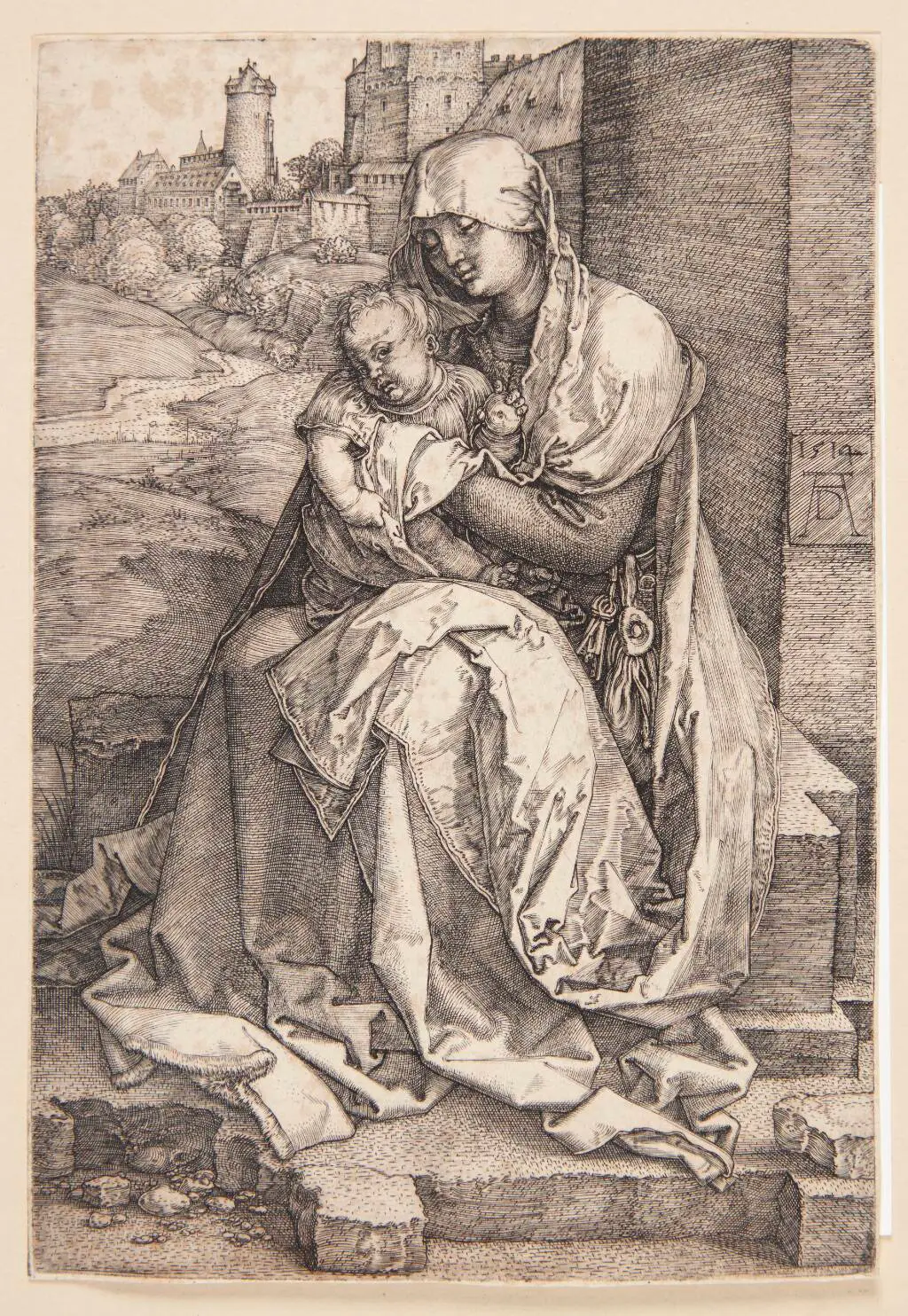 Madonna, siddende ved en mur